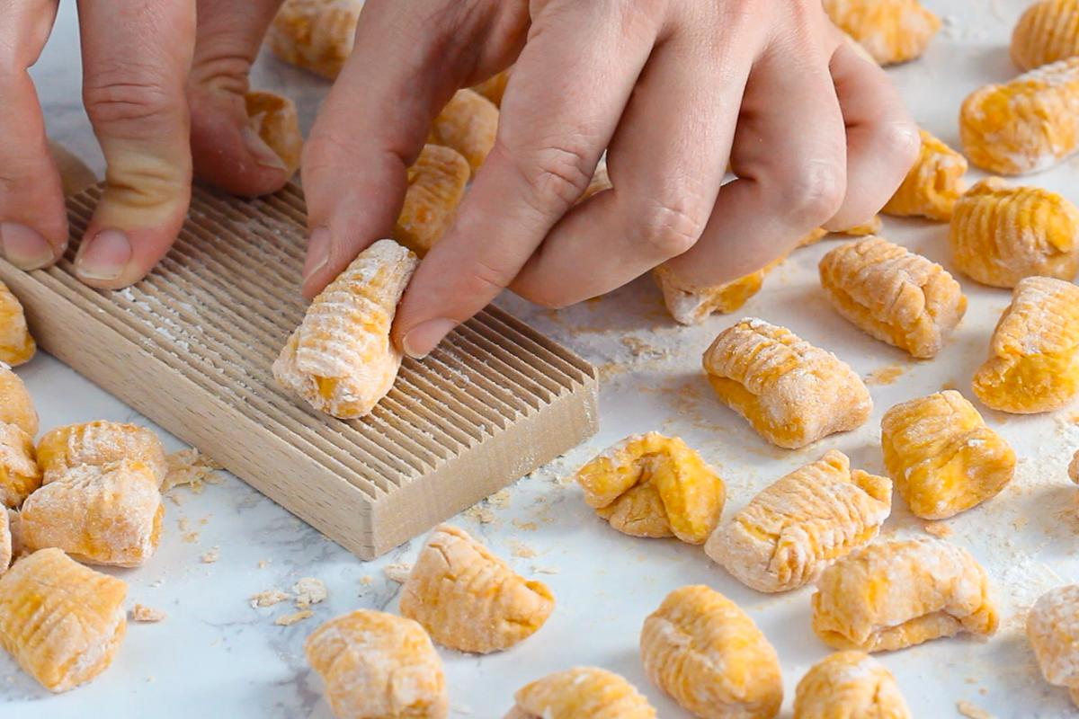 sweet potato gnocchi on a gnocchi board