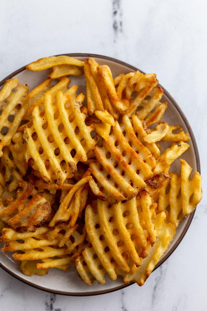 plate full of waffle fries