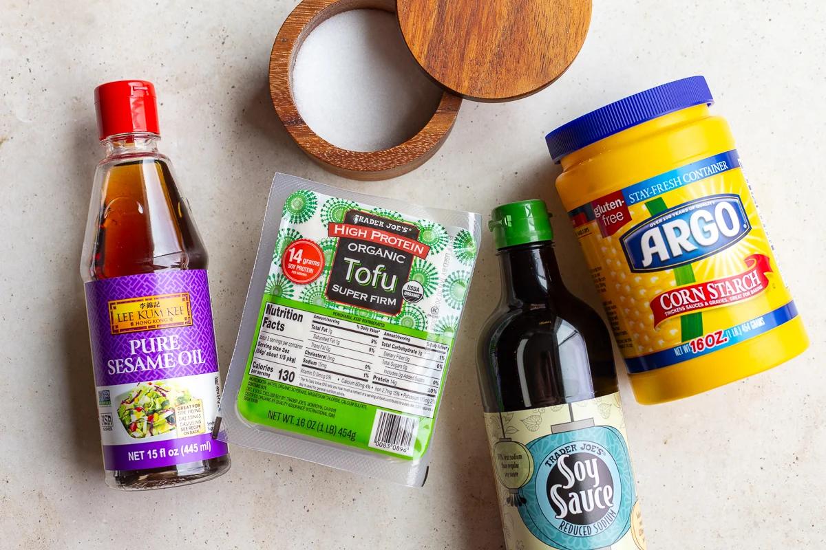 ingredients needed to make air fryer tofu including tofu, soy sauce, sesame oil, salt and cornstarch