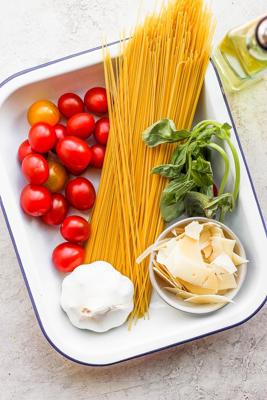 Spaghetti ingredients in a white bowl.