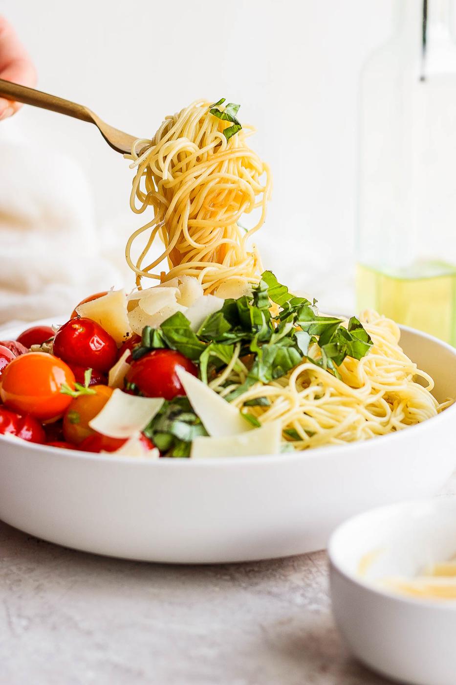 Swirling pasta around a fork.