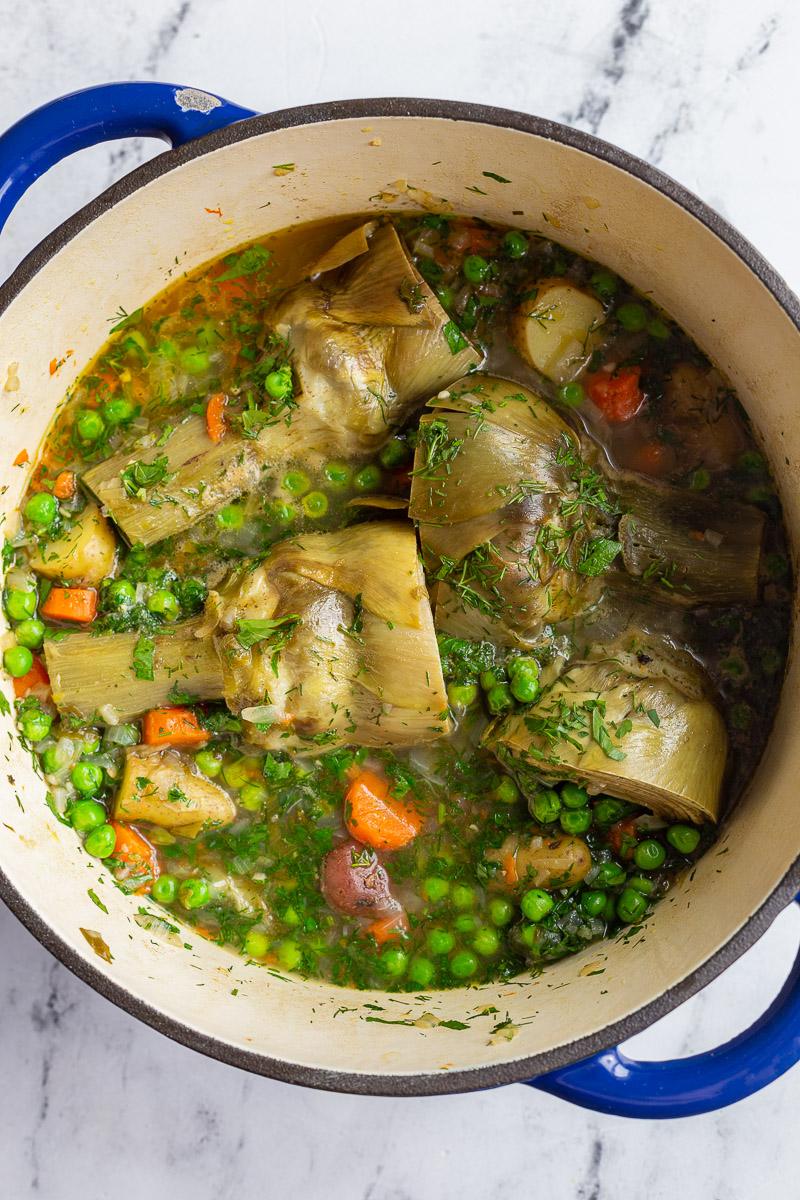 artichokes constantinople- steamed artichoke in a veggie stew in a large pot