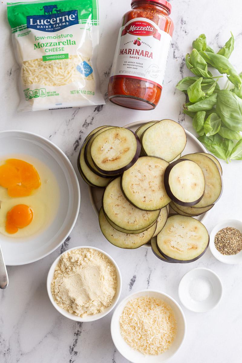 Uncooked ingredients to make eggplant recipe divided into portions.