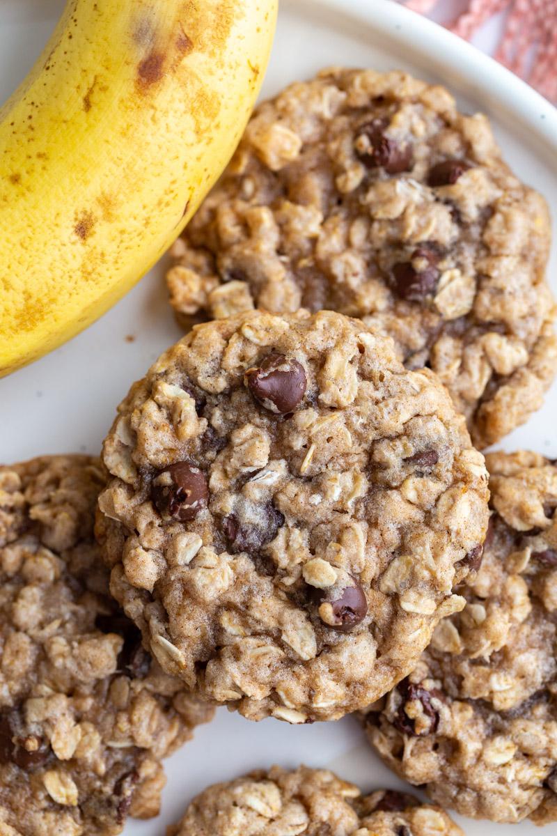 banana oatmeal cookies stacked on a white plate