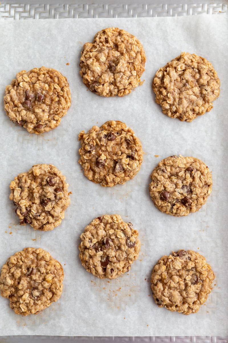 banana chocolate chips cookies on a sheet pan lined with parchment paper