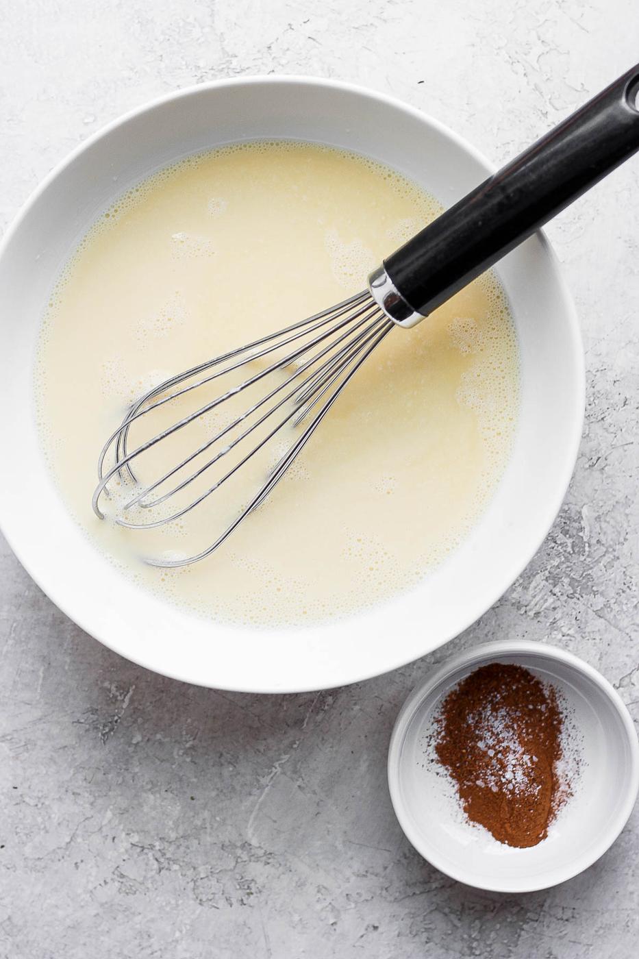 Whisking an egg custard mixture.