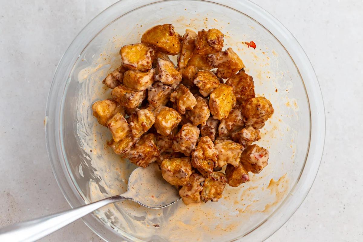bang bang tofu in a large bowl with a spoon