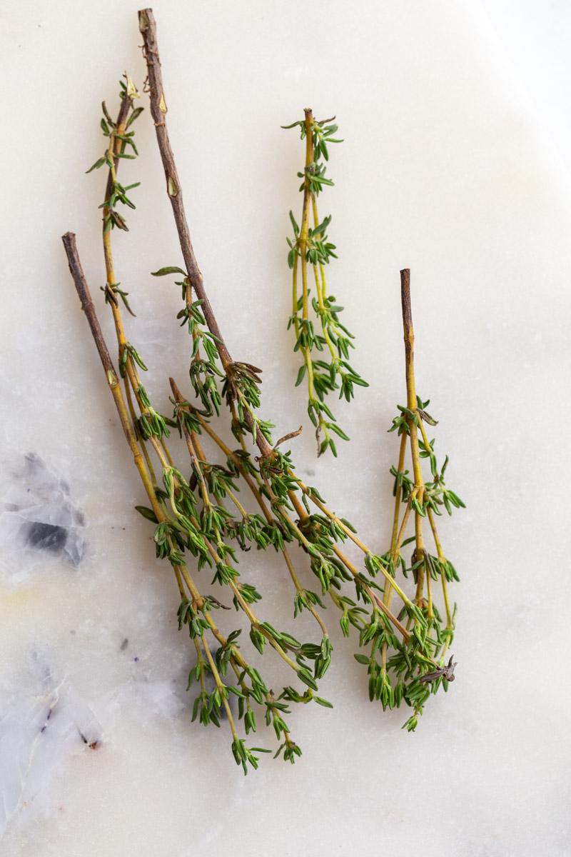 fresh thyme on a marble board