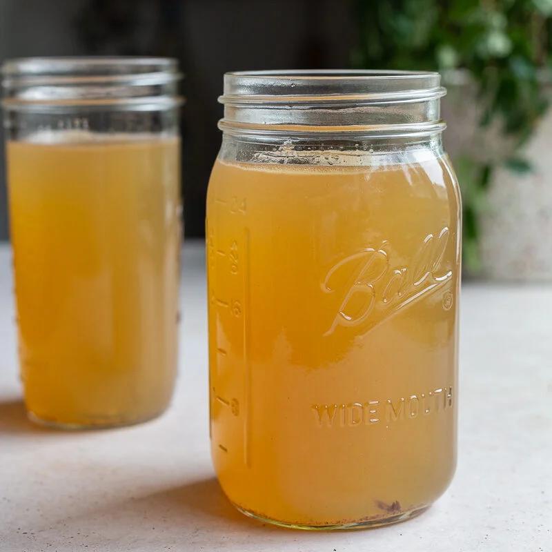 2 large mason jars of bone broth for dogs