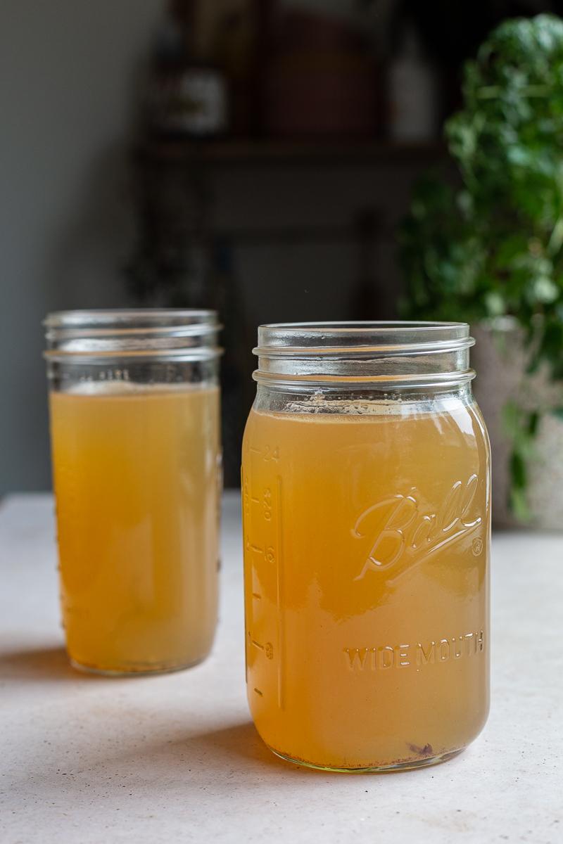 2 large mason jars of bone broth for dogs