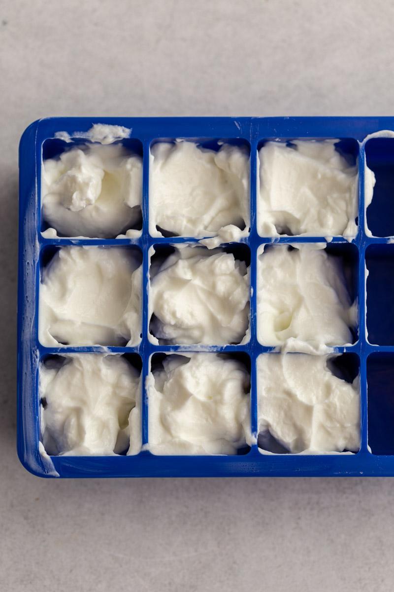 ice cube tray filled with sour cream