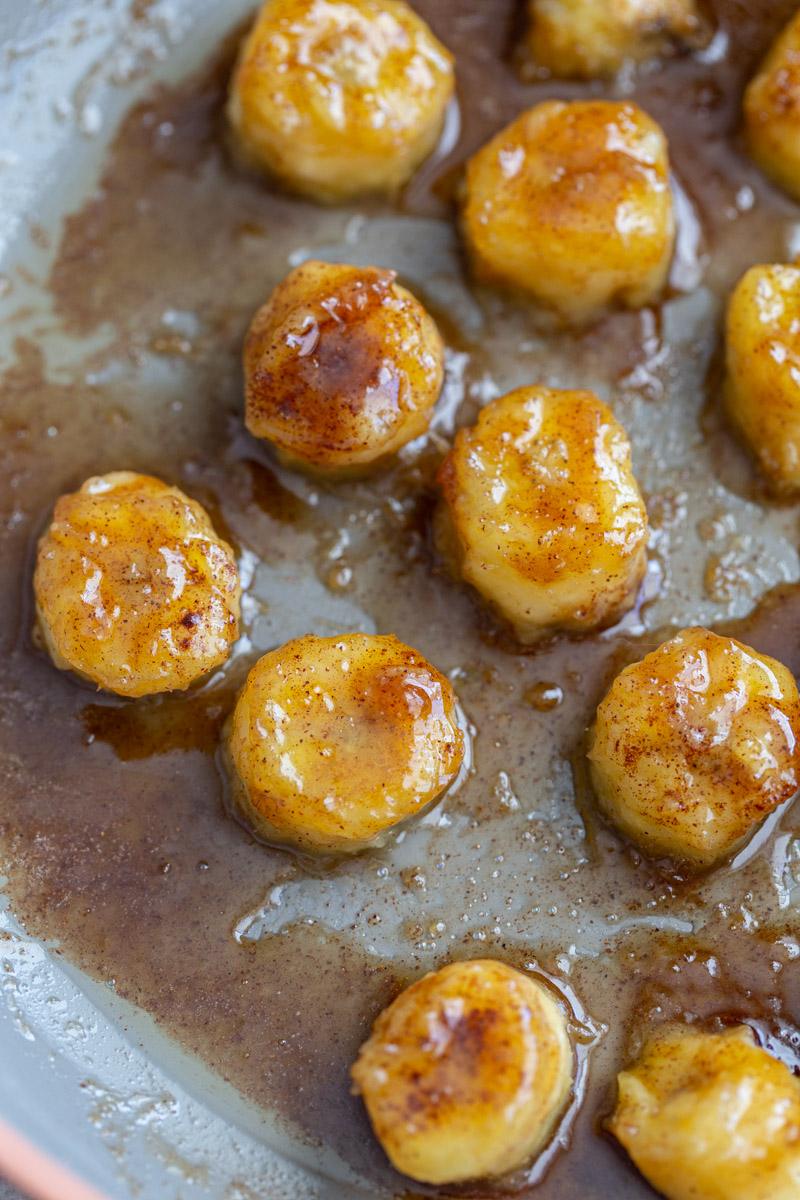 caramelized bananas cooking on a skillet