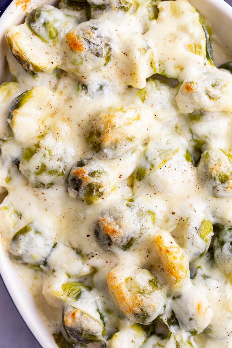 up close shot of cheesy brussels sprouts au gratin