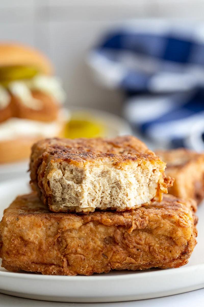 tofu "chicken" filets with one cut in half to see the spongey center