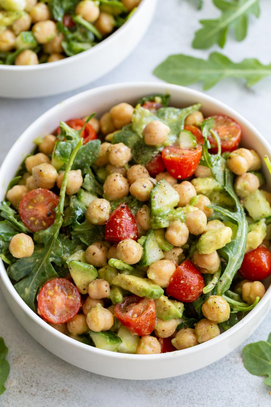 chickpea avocado salad with cherry tomatoes and arugula