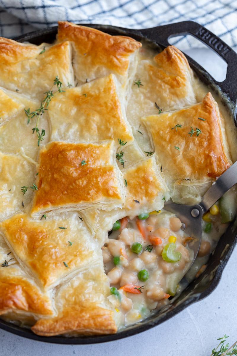 serving puff pastry pot pie out of a skillet