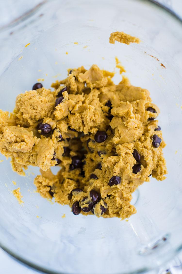 Chocolate Chip Pumpkin Cookie dough in a glass bowl