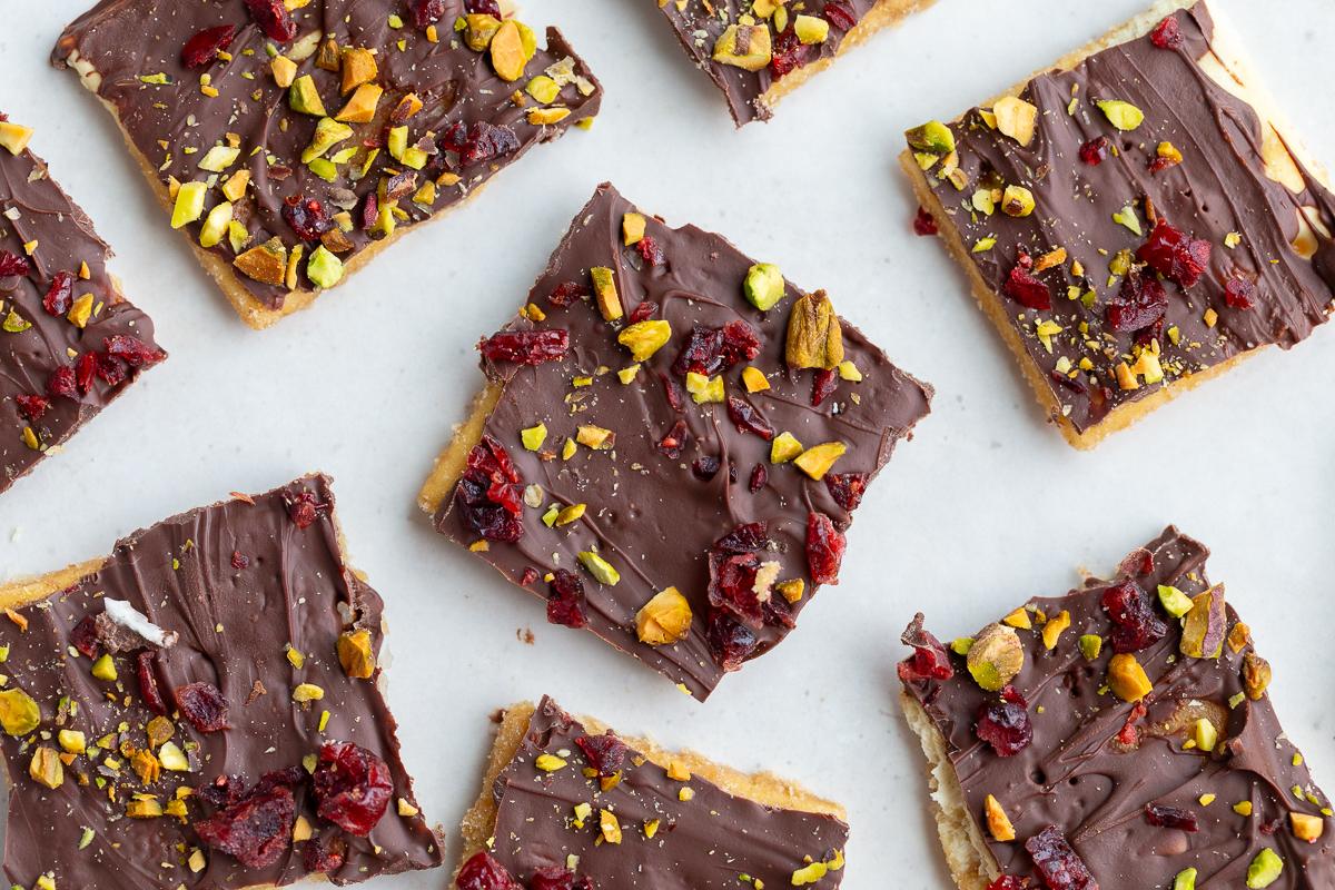 christmas cracker candy topped with cranberries and pistachios