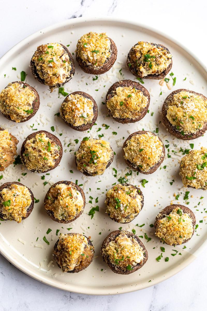 Cream cheese mushroom appetizer on a large white plate.