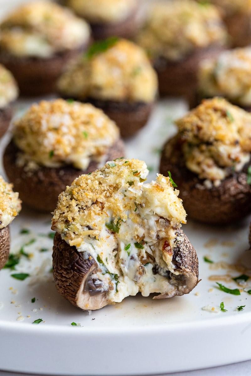 Stuffed mushroom with a bite taken out.