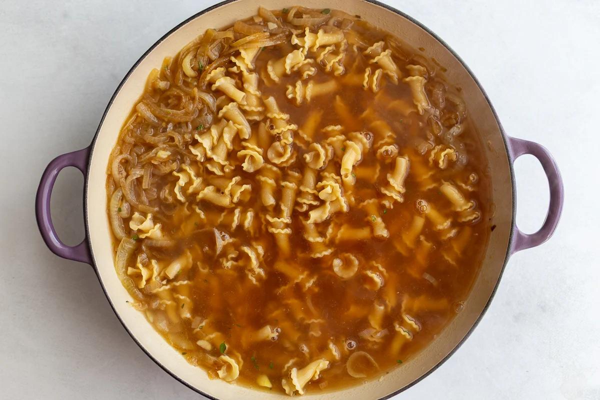 french onion pasta in a pot before the pasta has been fully cooked