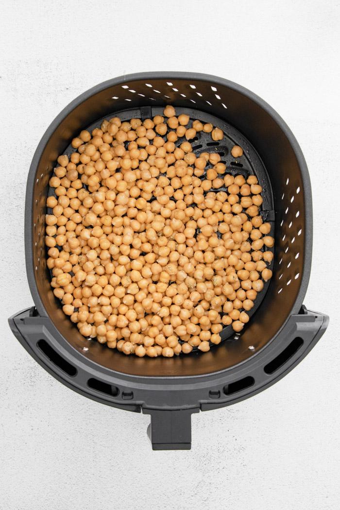 chickpeas in the basket of an air fryer