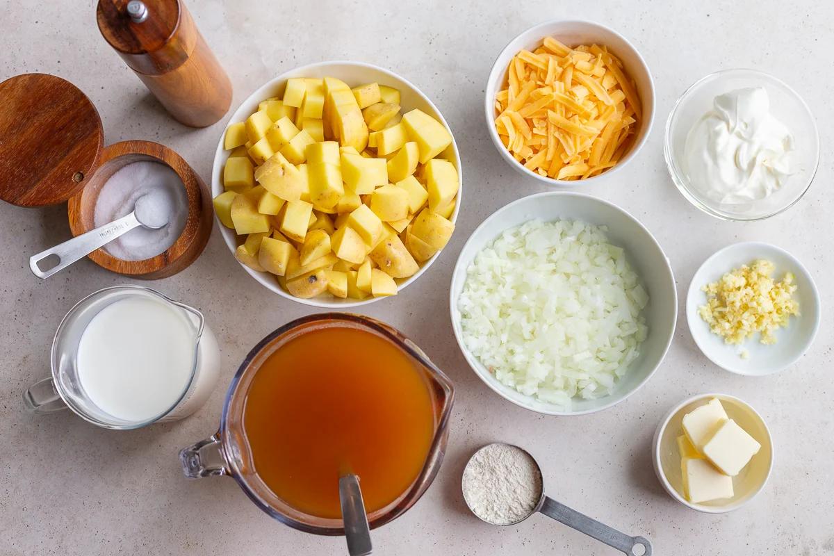 ingredients laid out to make potato soup in the crockpot