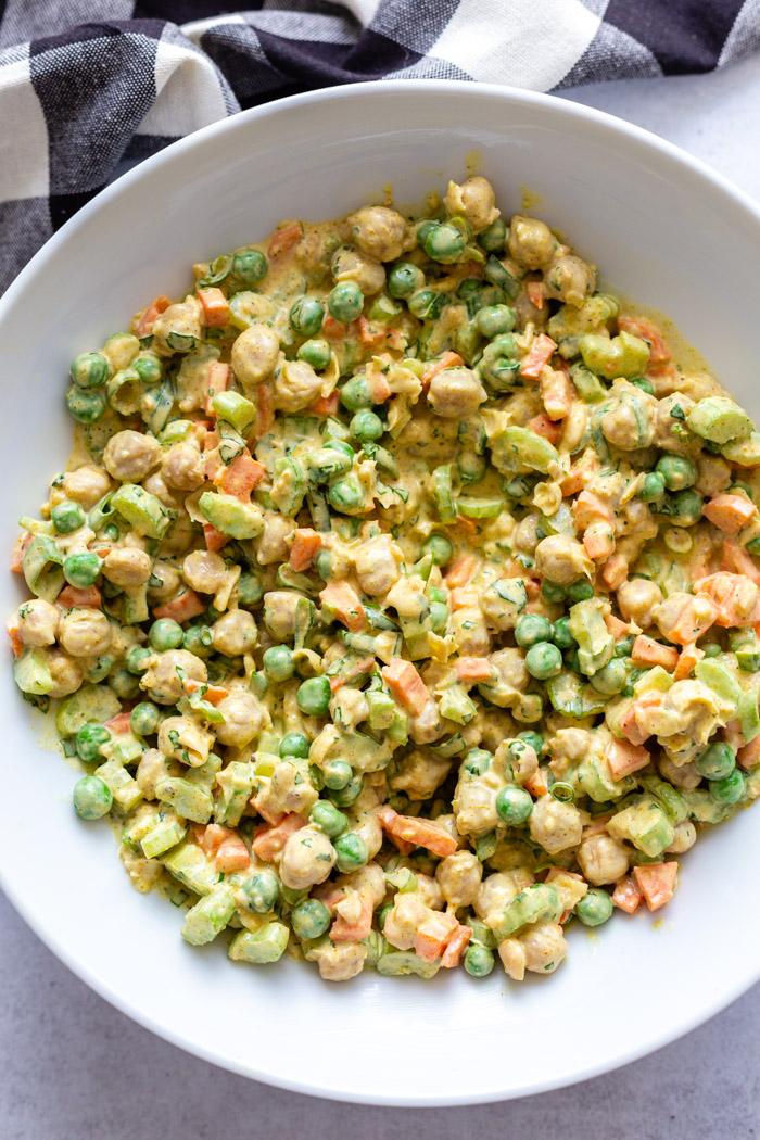 large white bowl filled with curried chickpea salad