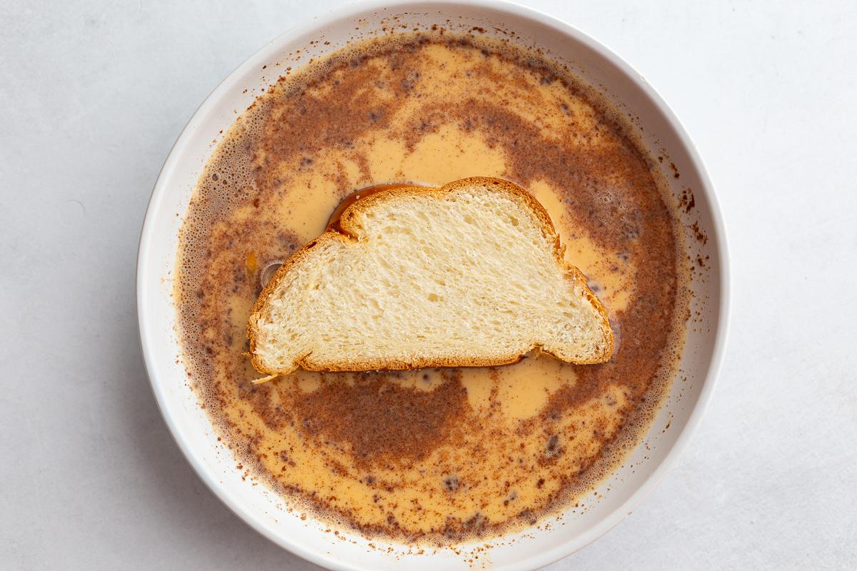 french toast batter in a wide bowl to make french toast with bread in the bowl