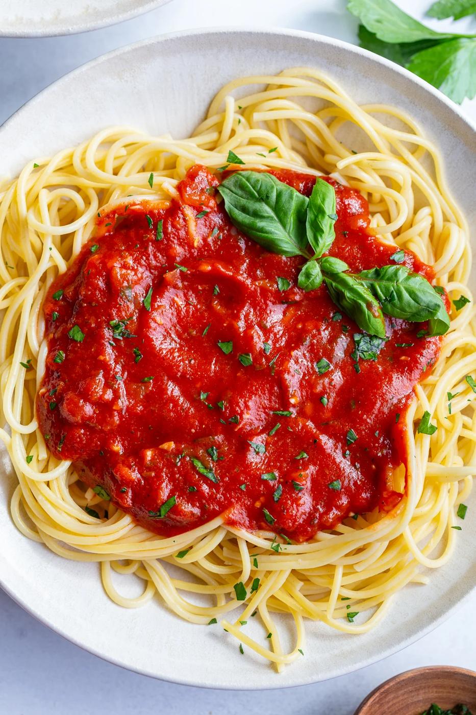 marinara sauce on a bed of spaghetti