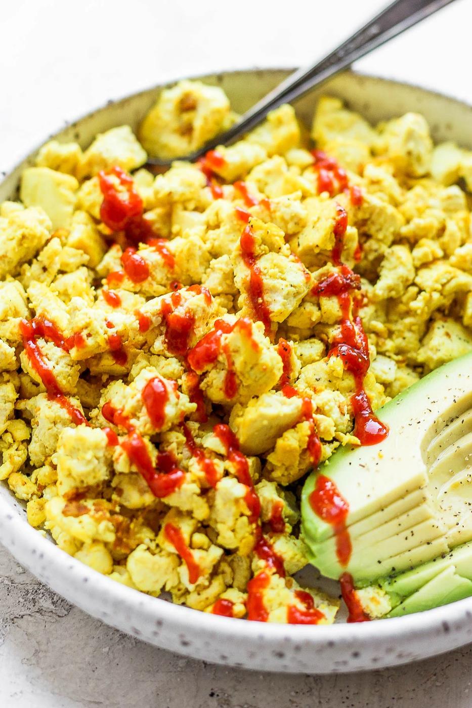 Vegan eggs made with tofu and topped with ketchup.