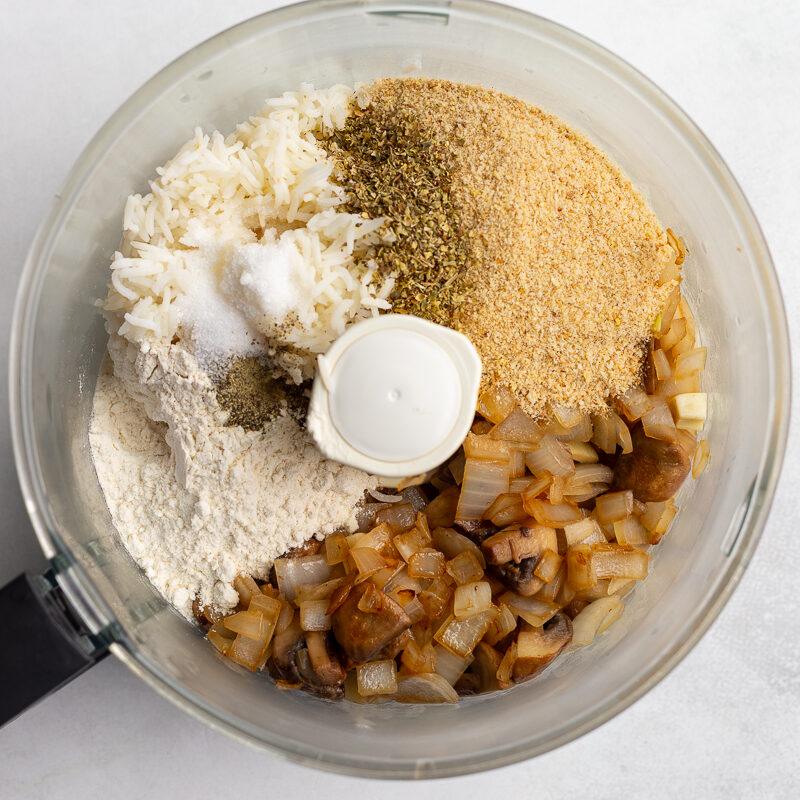 breadcrumbs, flour, cooked veggies, and rice in a food processor before its been blended