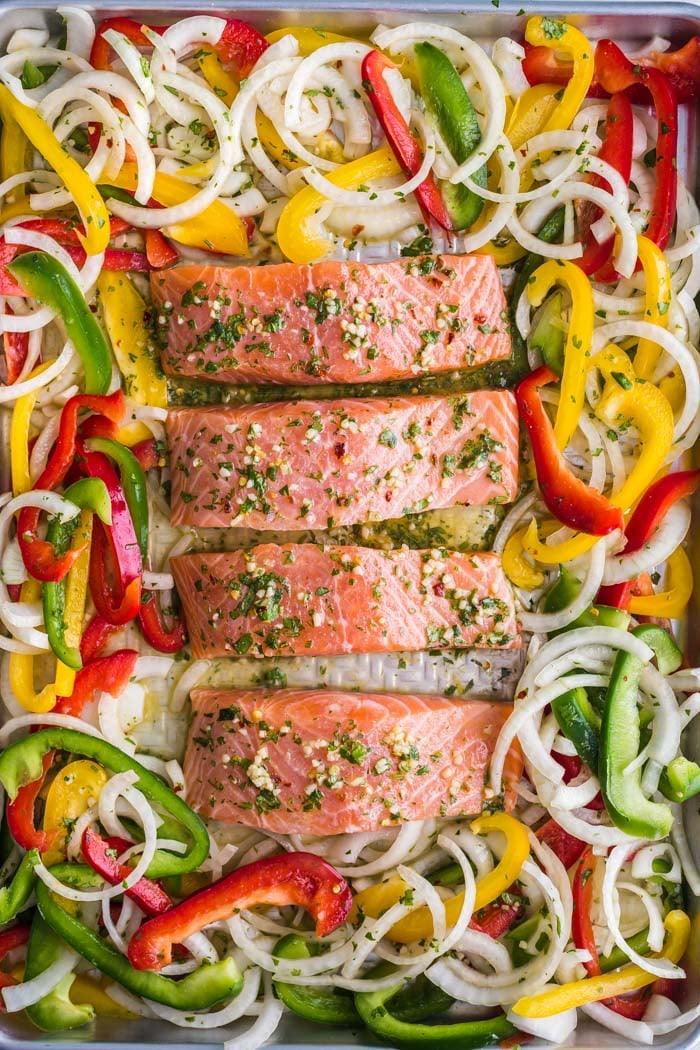salmon and veggies on a baking tray