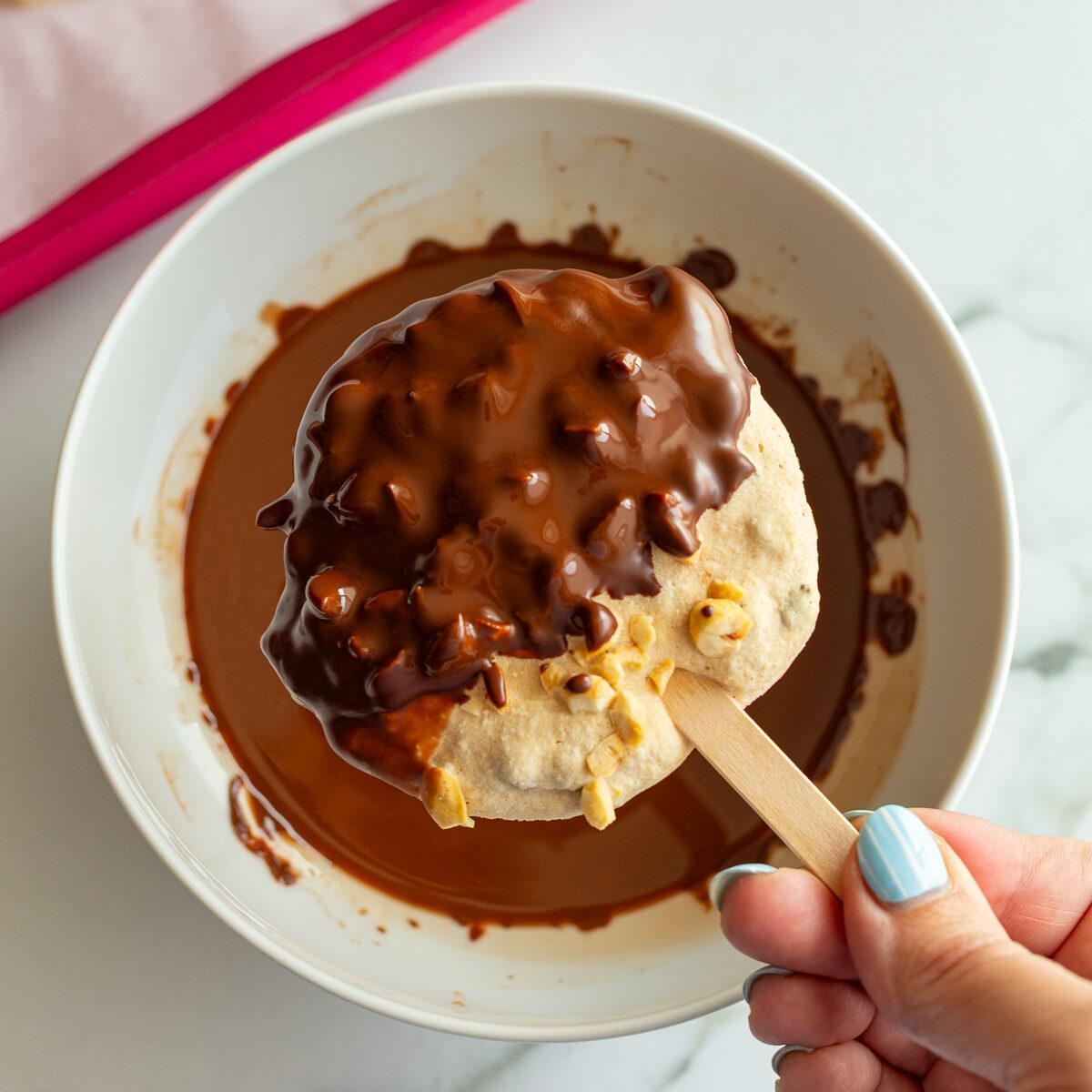 frozen yogurt bars half dipped in melted chocolate