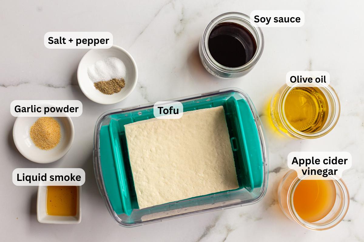 ingredients needed for grilled tofu that are all labeled including tofu, soy sauce, olive oil, apple cider vinegar, garlic powder etc