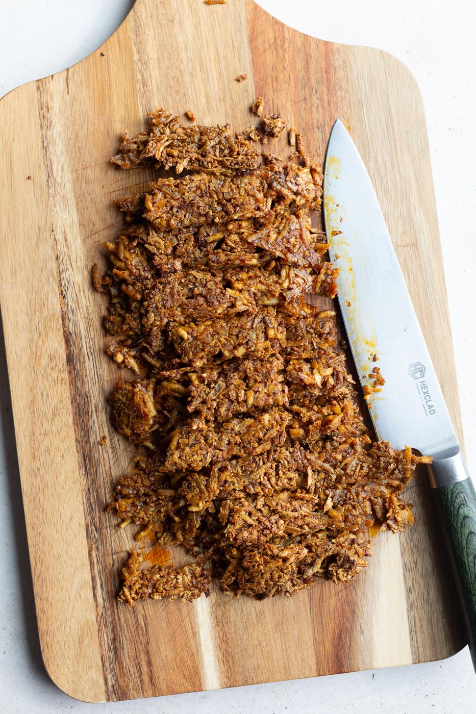 taco tofu cut up on a cutting baord