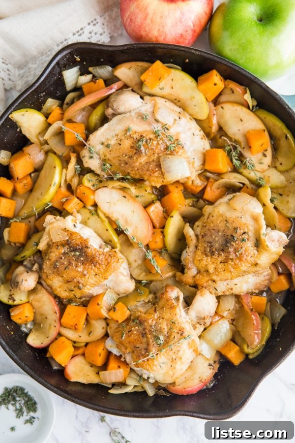 One Skillet Apple Cider Chicken, ready to serve, topped with its rich apple cider sauce.