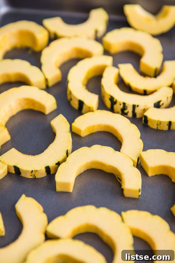 Close-up of roasted delicata squash slices with a sprinkle of cinnamon