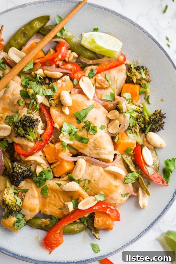 One-Pan Peanut Chicken & Veggie Bake 5 Golden brown sheet pan peanut chicken and veggies freshly baked.