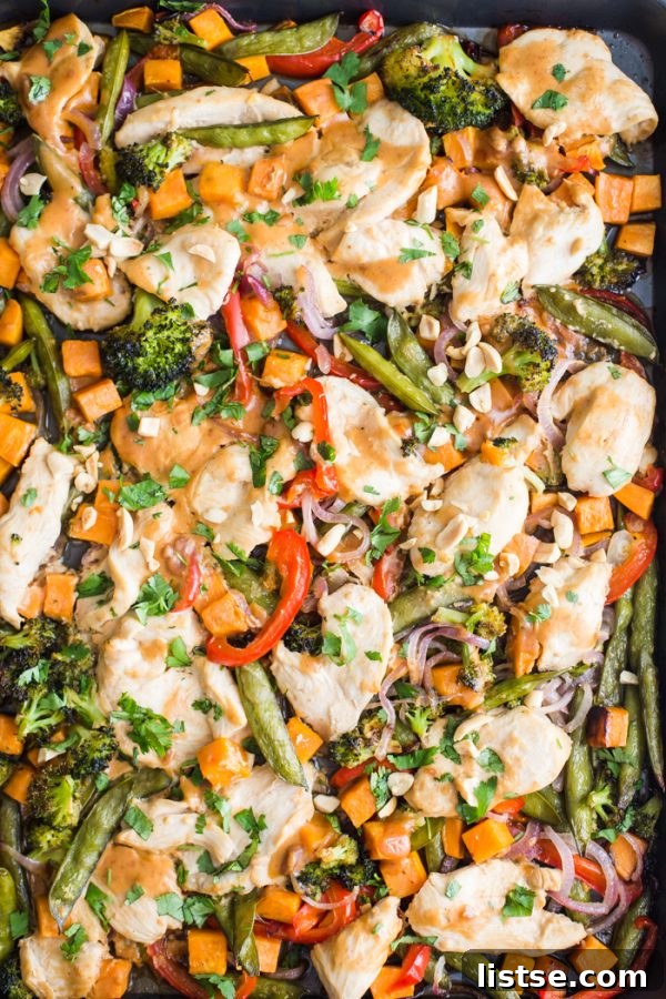 One-Pan Peanut Chicken & Veggie Bake 6 A vibrant close-up of sheet pan peanut chicken with fresh cilantro and lime, ready to be enjoyed.