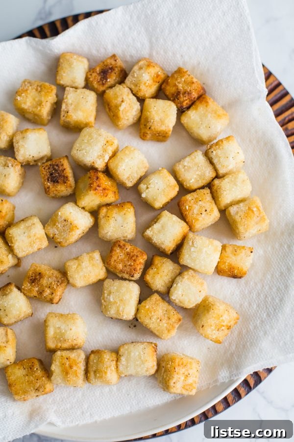 Crispy tofu cubes coated in sweet chile sauce, ready to be served.