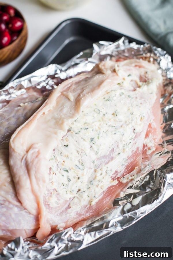 A delicious spread of Thanksgiving dinner for two, prepared on one sheet pan.
