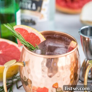 Grapefruit Moscow Mule in a copper mug with grapefruit slices