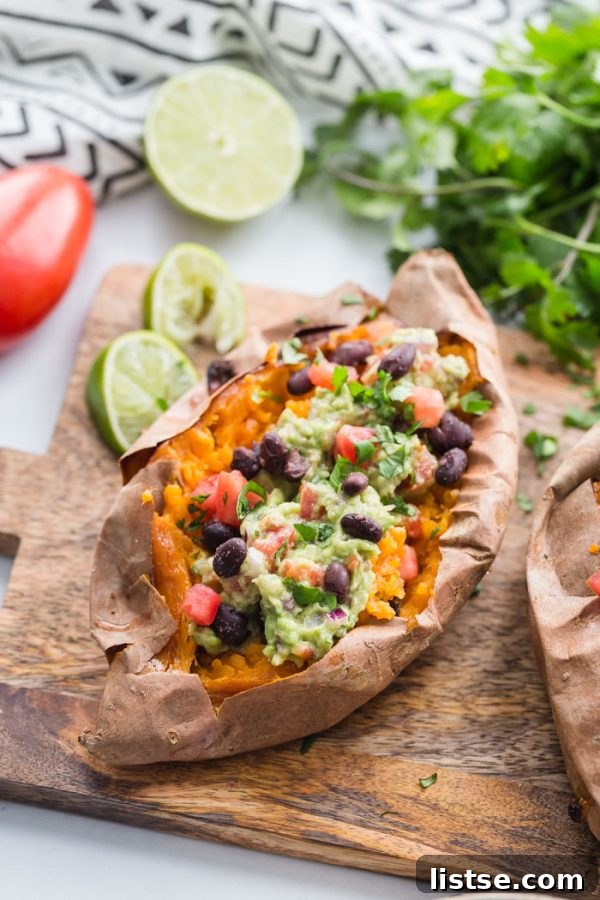 Guacamole Stuffed Sweet Potatoes - a simple, hearty, and delicious vegan dinner option or side dish, overflowing with fresh ingredients.