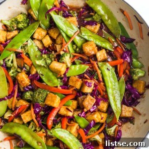Crispy Tofu Stir Fry in a skillet, showcasing the rich colors and textures of the dish.
