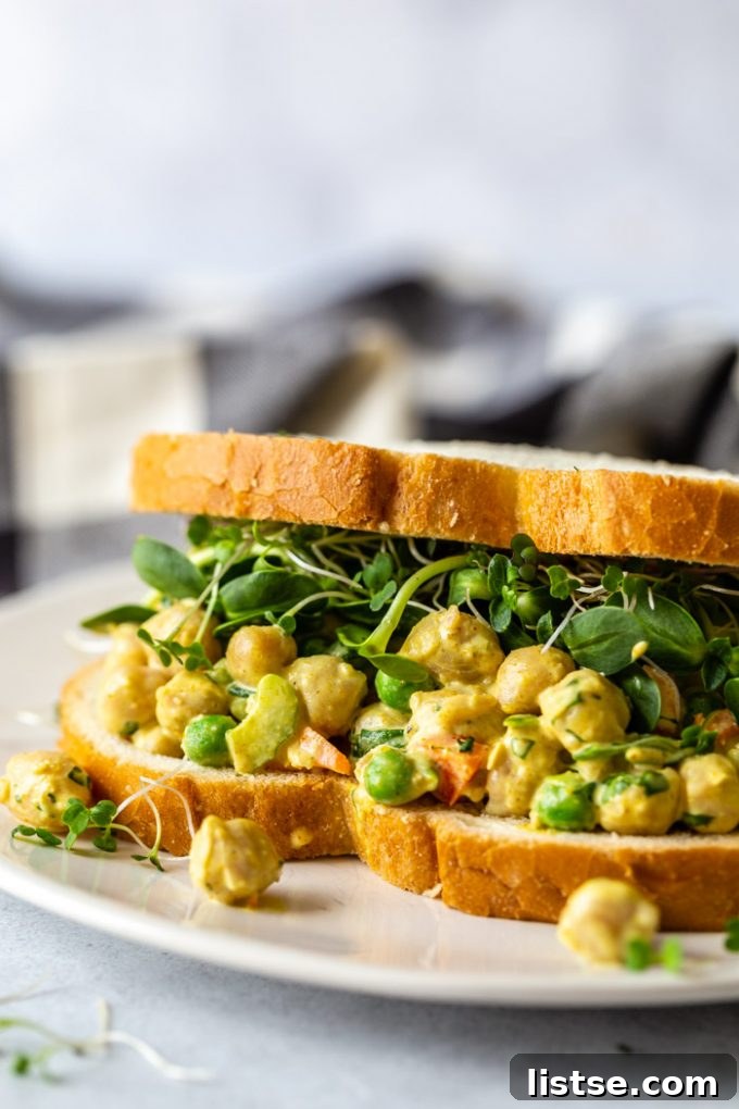 Chickpea salad served on a sandwich, a creamy and flavorful vegan filling.