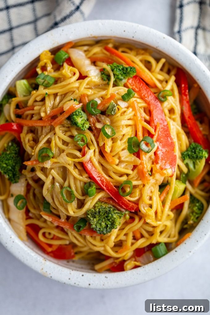 Vegan Chow Mein in a small white bowl, ready to be enjoyed.