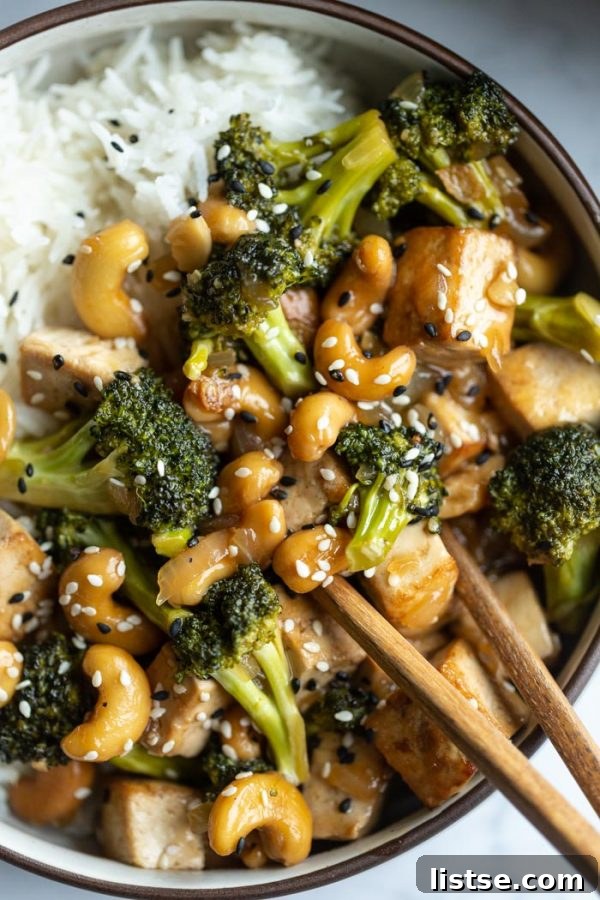 Cashew tofu stir-fry, vibrant with fresh vegetables and a savory sauce.