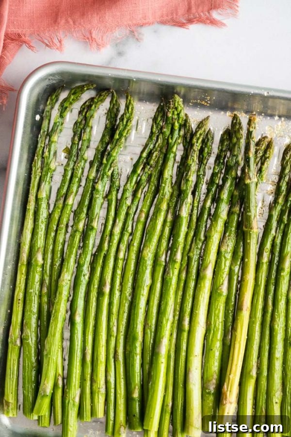 Easy Roasted Asparagus on a baking tray, perfectly cooked and healthy