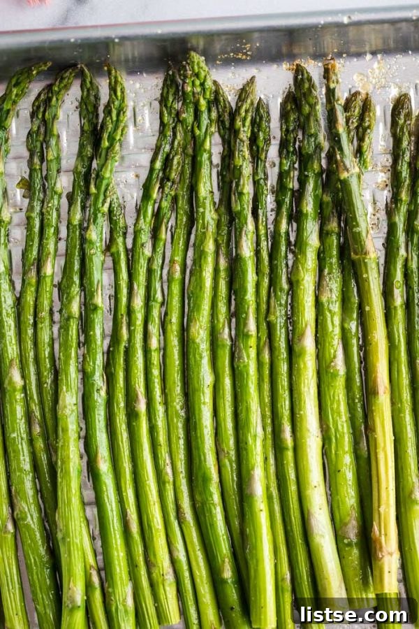 Fresh Asparagus ready for roasting on a small baking sheet